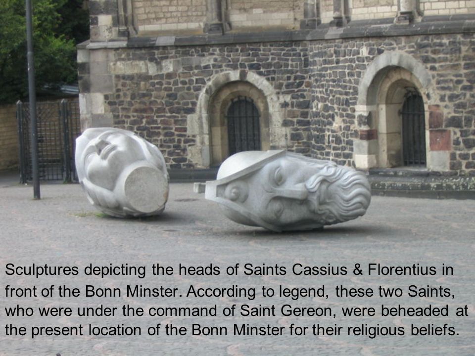 Sculptures depicting the heads of Saints Cassius & Florentius in front of the Bonn Minster.