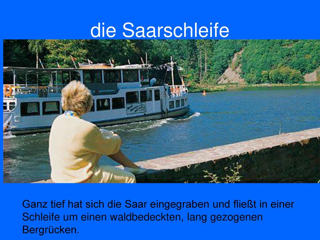 die Saarschleife Ganz tief hat sich die Saar eingegraben und fließt in einer Schleife um einen waldbedeckten, lang gezogenen Bergrücken.