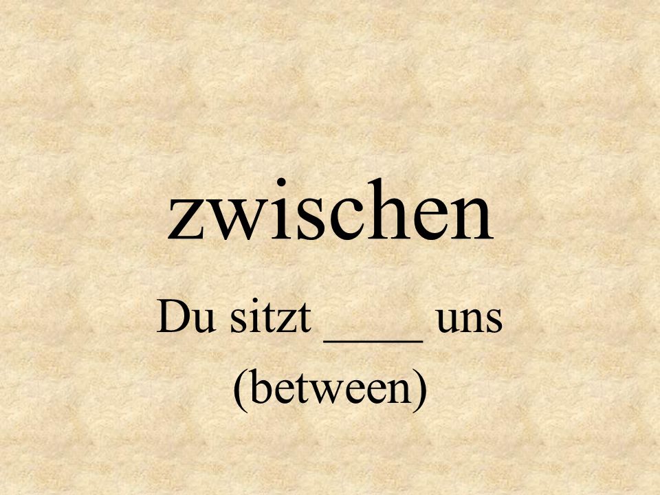 Du sitzt ____ uns (between)