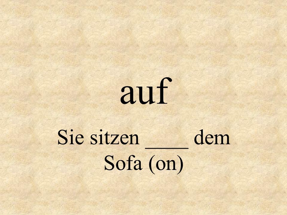 Sie sitzen ____ dem Sofa (on)